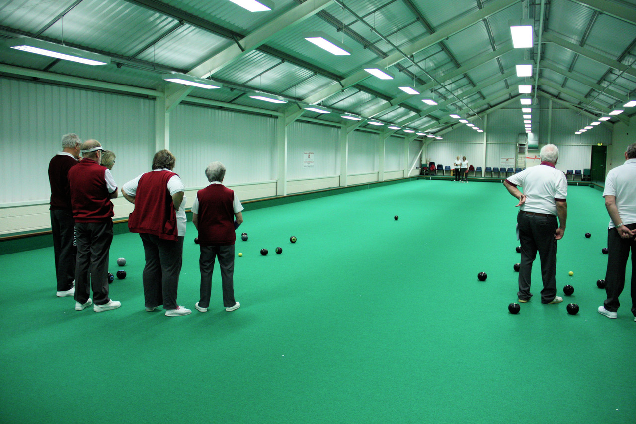 Members playing bowls using the indoor rinks